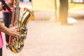 Children are blowing baritone Saxophone jazz music Royalty Free Stock Photo