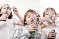 Children blowing bubbles Royalty Free Stock Photo
