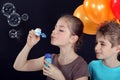 Children blowing bubbles Royalty Free Stock Photo