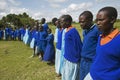 Children in blue lineup at school near Tsavo National Park, Kenya, Africa