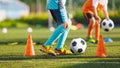 Children in Blue and Orange Soccer Team in Training. Two Kids Playing Football Ball on Grass Field Royalty Free Stock Photo
