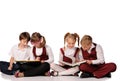 children with books siiting on the floor