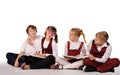 children with books siiting on the floor