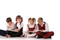 children with books siiting on the floor