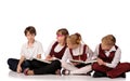 children with books siiting on the floor