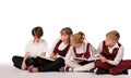 children with books siiting on the floor