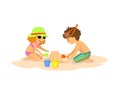 Children, boy and a gilr building, making sand castle on the beach