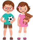 Children boy and girl holding toy teddy bear and soccer ball Royalty Free Stock Photo