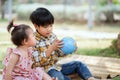 children boy and girl looking at globe for learning world map Royalty Free Stock Photo