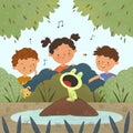 children boys and girl and puppy listening to the singing frog on the lake talent