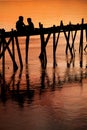 Children on bridge sunset silhouette Royalty Free Stock Photo