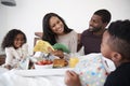 Children Bringing Mother Breakfast In Bed To Celebrate Mothers Day Or Birthday Royalty Free Stock Photo