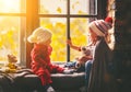 Children brother and sister admiring window for autumn Royalty Free Stock Photo