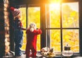 Children brother and sister admiring window for autumn Royalty Free Stock Photo