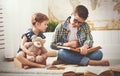 Children brother and sister, boy and girl reading a book