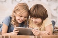 Children brother and sister family time together indoors Royalty Free Stock Photo