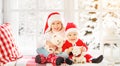 Children brother and sister laughing and sitting on the winter window Christmas