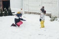 Children, brother and sister play in the backyard of their house in the snow. Winter, winter fun, family walks Royalty Free Stock Photo