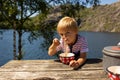 Children, brothers, eating lunch on a public rest stop in Norway, amazing nature around Royalty Free Stock Photo