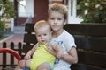 Children brothers sitting on bench