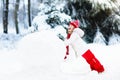 Kids building snowman. Children in snow. Winter fun.