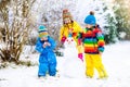 Kids building snowman. Children in snow. Winter fun. Royalty Free Stock Photo