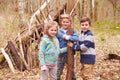 Children Building Camp In Forest Together