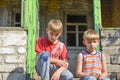 Children in a burnt house lost their homes as a result of hostilities and natural disasters Royalty Free Stock Photo