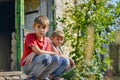 Children in a burnt house lost their homes as a result of hostilities and natural disasters Royalty Free Stock Photo