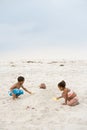 Children burying father in sand Royalty Free Stock Photo