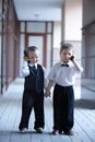 Children in business suit outdoors.