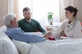 Children caring about ill father Royalty Free Stock Photo