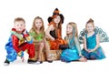 Children in carnival costumes sit on chest Royalty Free Stock Photo
