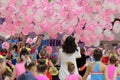 children catch balloons falling from the ceiling, cheerleaders have fun after the competition