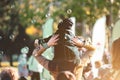 Children catch soap bubbles with their hands at a street party