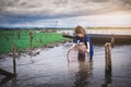 Children catching fish and have fun in the canal. Life style of children