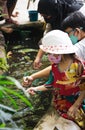Children catching fish at the small water tunnel