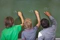 Children, chalkboard and school writing with education, cursive and answer for learning. Back, knowledge and youth Royalty Free Stock Photo
