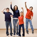 Children cheering and celebrating their success Royalty Free Stock Photo