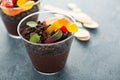 Children chocolate dessert in a cup dirt and worms