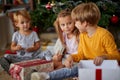 Children  with Christmas presents. kids open present Royalty Free Stock Photo