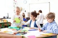 Children in the classroom painting pictures during art classes