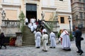 Children climb the stairs to the service in the Catholic Church