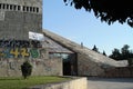 Children climb up the slope of The Pyramid in Tirana, Albania