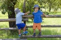 Children climbing garden fence Royalty Free Stock Photo