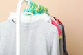 Children clothes on a hanger on a colored background. Royalty Free Stock Photo