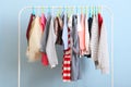 Children clothes on a hanger on a colored background. Royalty Free Stock Photo