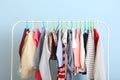 Children clothes on a hanger on a colored background. Royalty Free Stock Photo