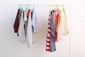 Children clothes on a hanger on a colored background. Royalty Free Stock Photo