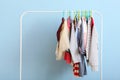 Children clothes on a hanger on a colored background. Royalty Free Stock Photo